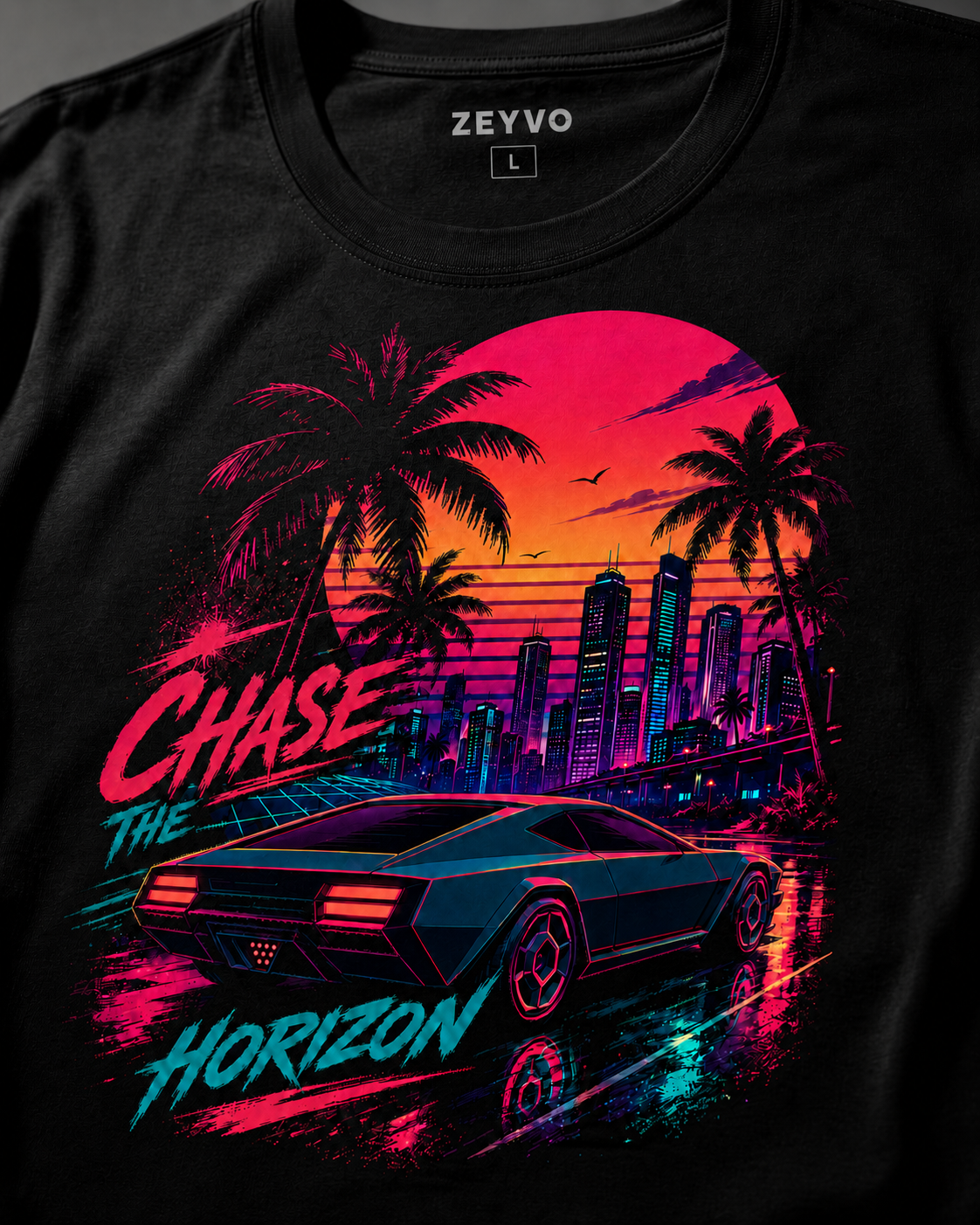 A black short-sleeve graphic t-shirt featuring a vibrant retro-futuristic design with the text 'Chase the Horizon'. The graphic depicts a black sports car driving past palm trees and a neon-lit city skyline under a pink and orange sunset.
